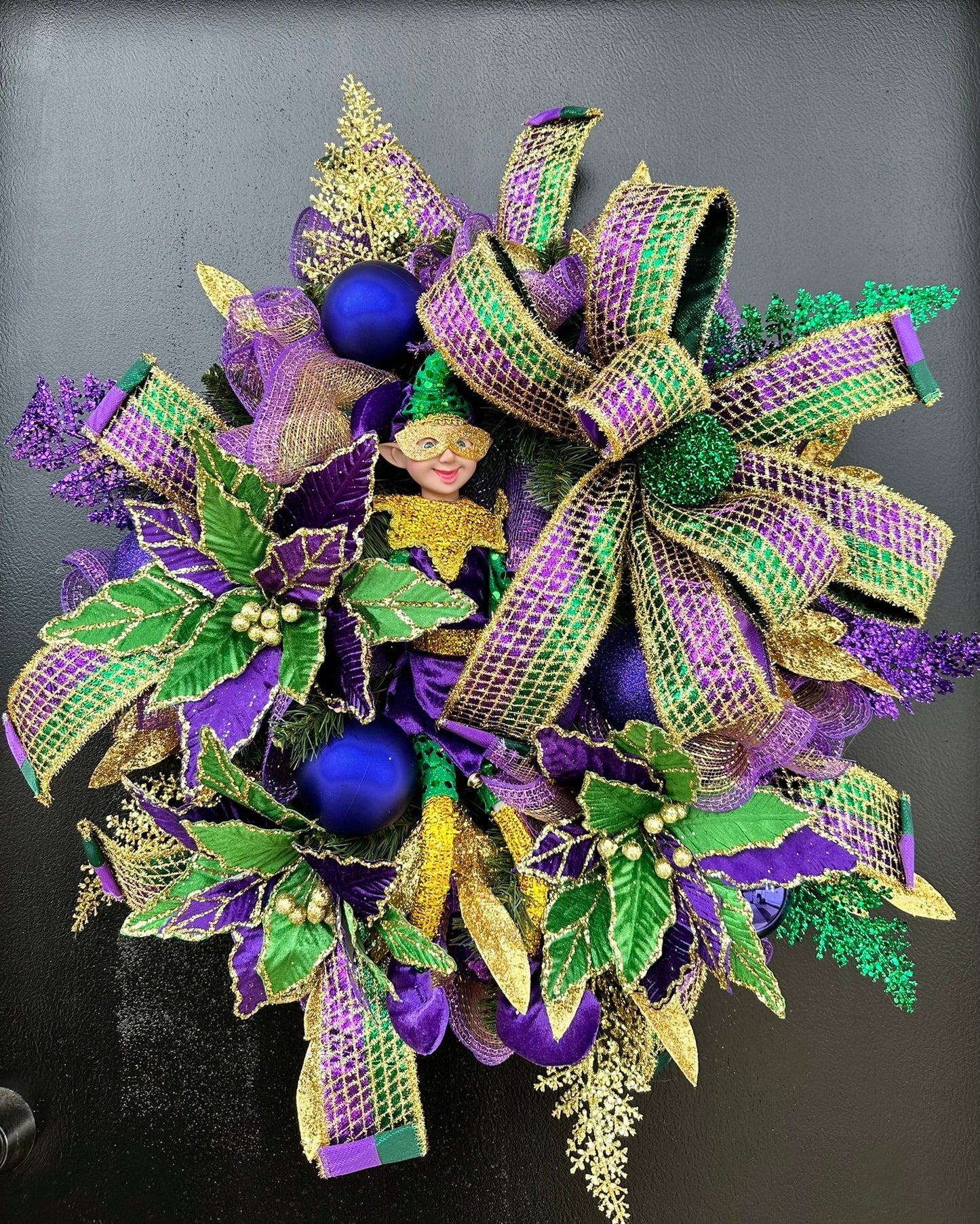 Colorful Mardi Gras Jester Wreath - Festive 32x28 Holiday Door Decor with Poinsettia Flowers, Jester Character Wreath, and Glitter Accents