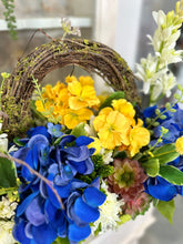 Load image into Gallery viewer, Blue Hydrangea &amp; Yellow Primrose Floral Arrangement in Wooden Dough Bowl – High-End Spring Table Centerpiece