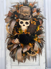 Load image into Gallery viewer, Oversized Steampunk Skull Wreath | XL Halloween and Fall Decor | Animated Skull with Top Hat, Faux Leather Journal, and Wooden Gears